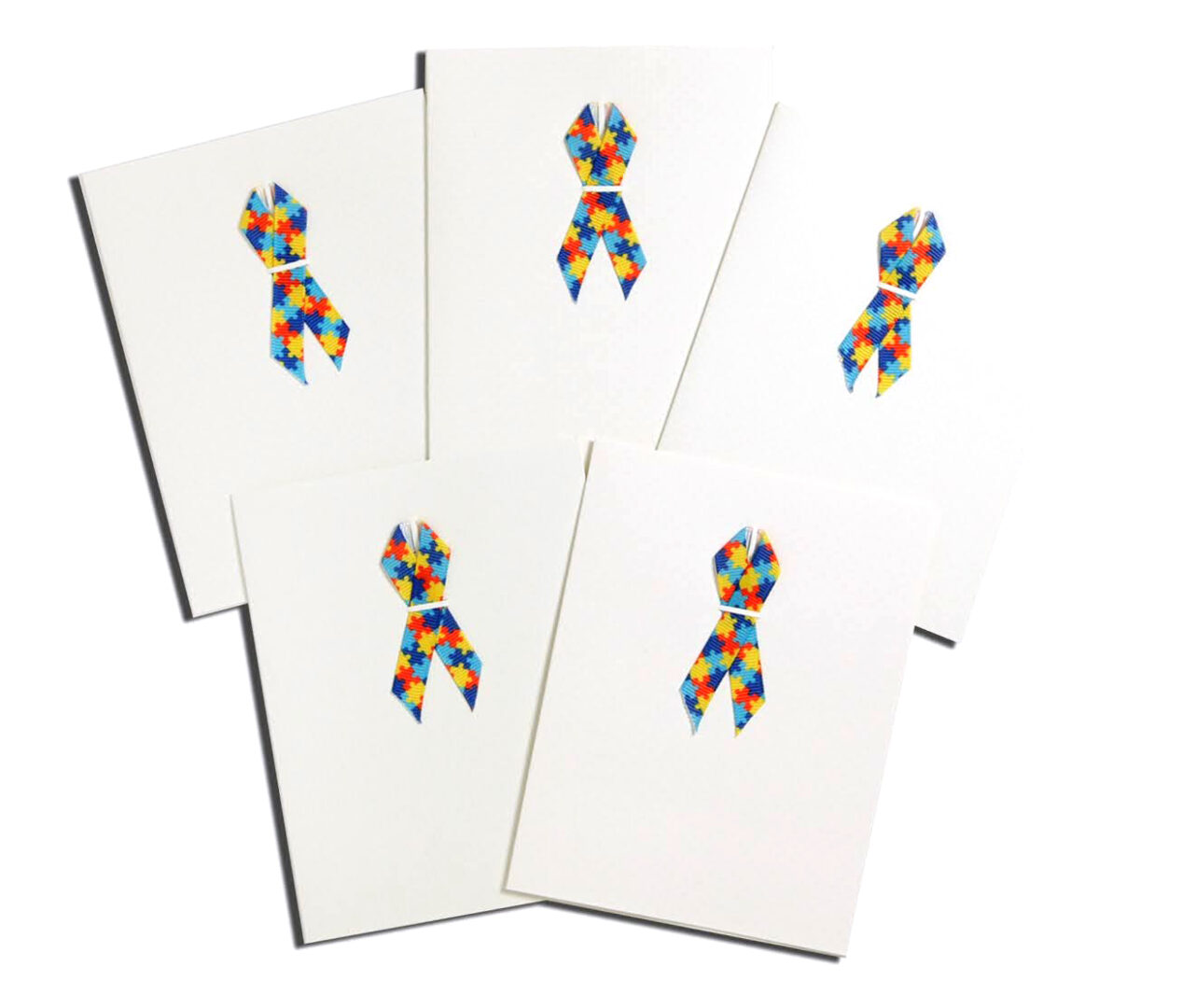 A set of six cards with ribbons on them.