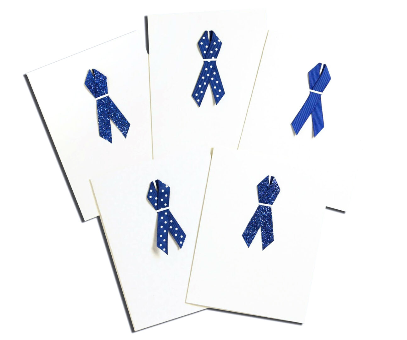 A group of cards with blue ribbons on them.