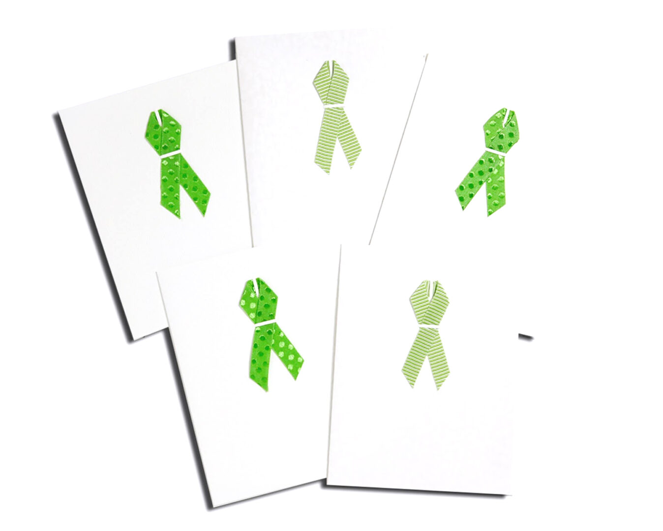 A set of four cards with green ribbons.