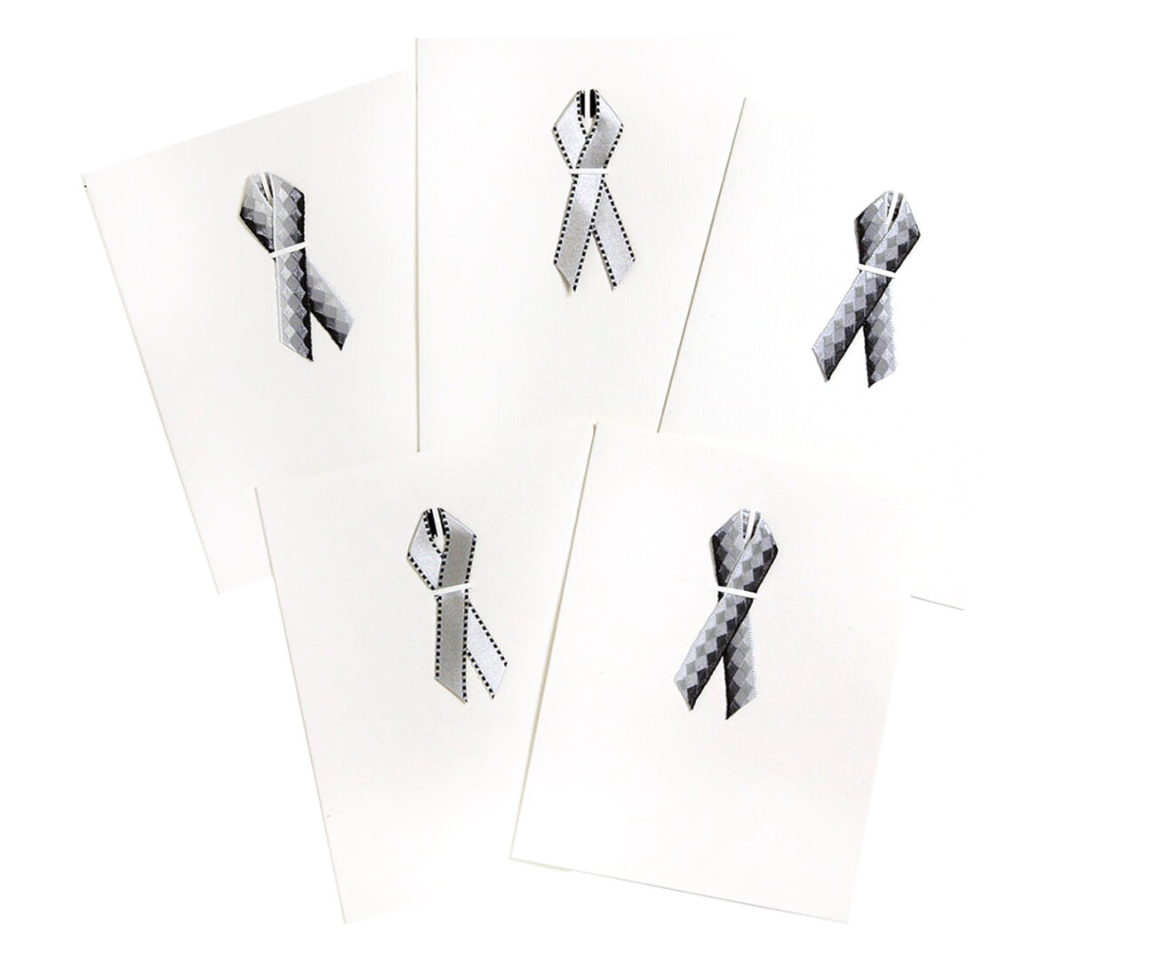 A set of five cards with different designs on them.