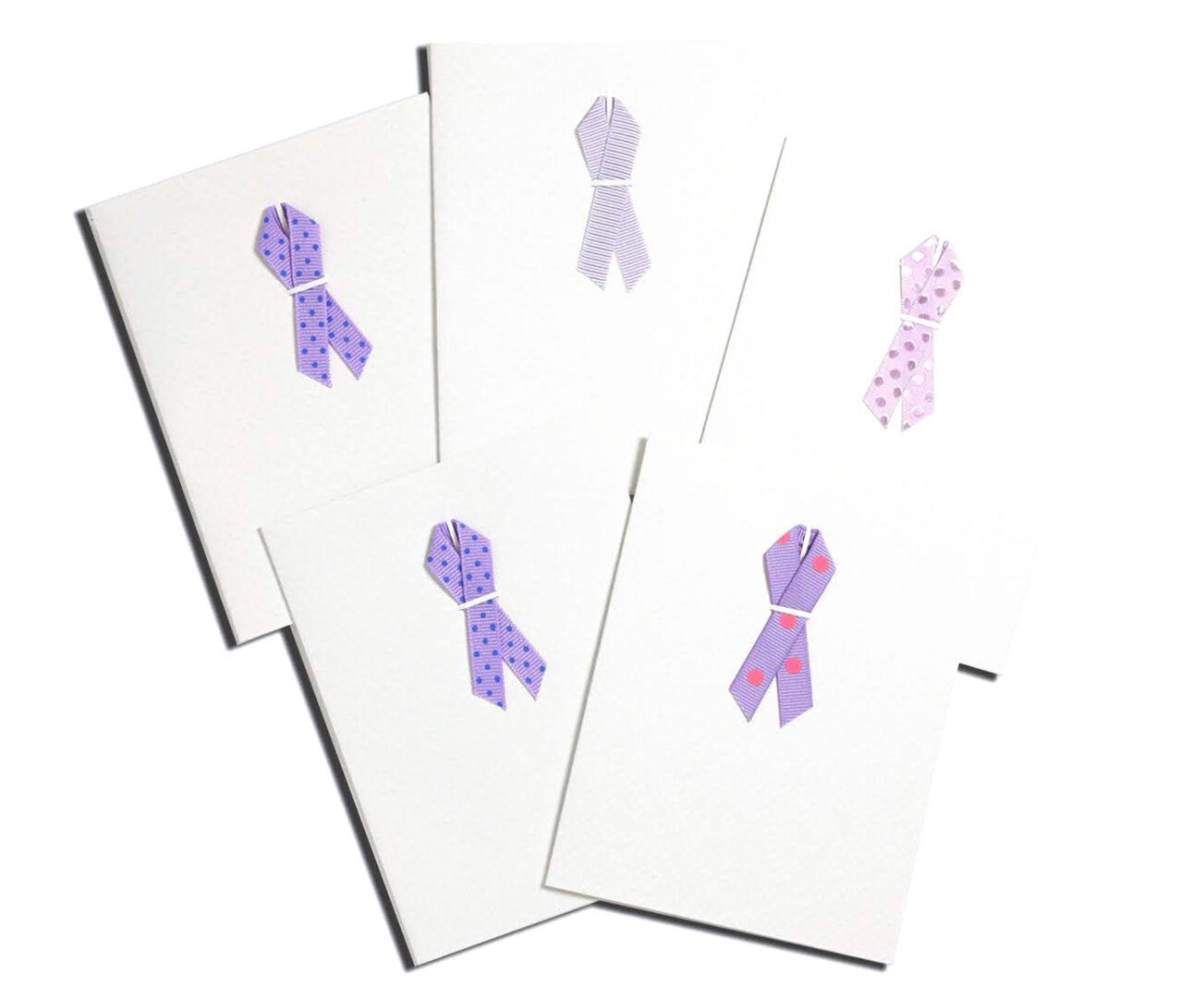 A group of cards with ribbons on them.